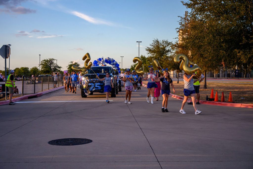 The Cox Elementary PTA float and Comet families in the Vista Ridge homecoming parade