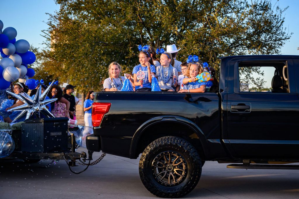 The Cox Elementary PTA float and Comet families in the Vista Ridge homecoming parade
