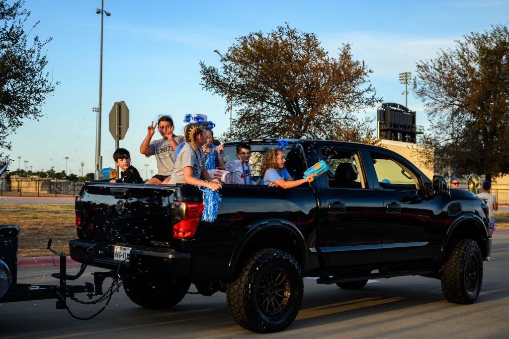 The Cox Elementary PTA float and Comet families in the Vista Ridge homecoming parade