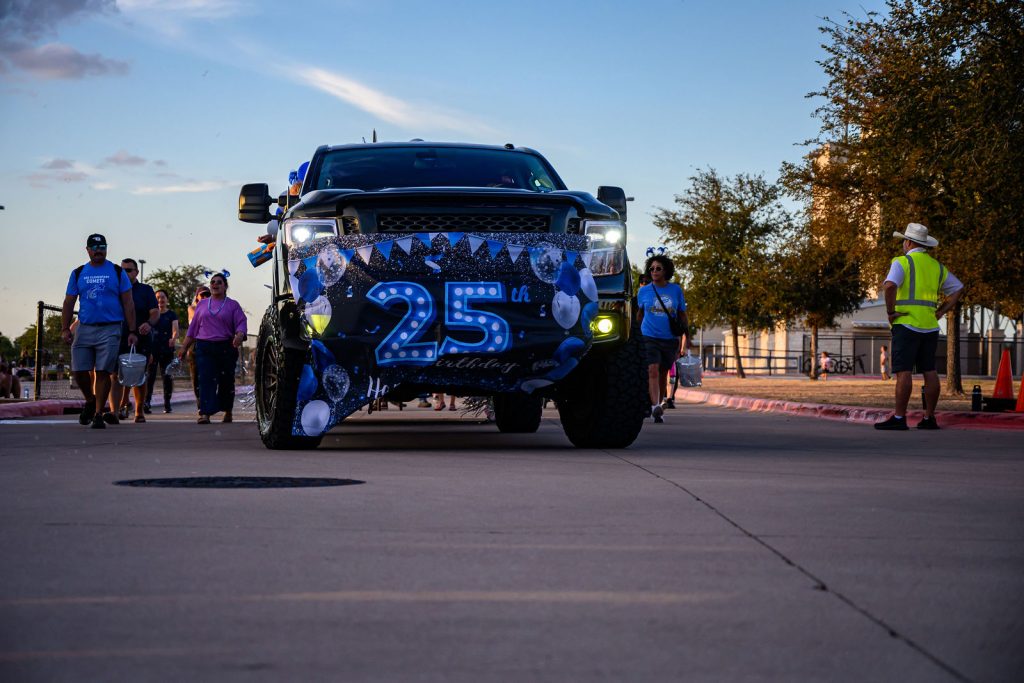 The Cox Elementary PTA float and Comet families in the Vista Ridge homecoming parade