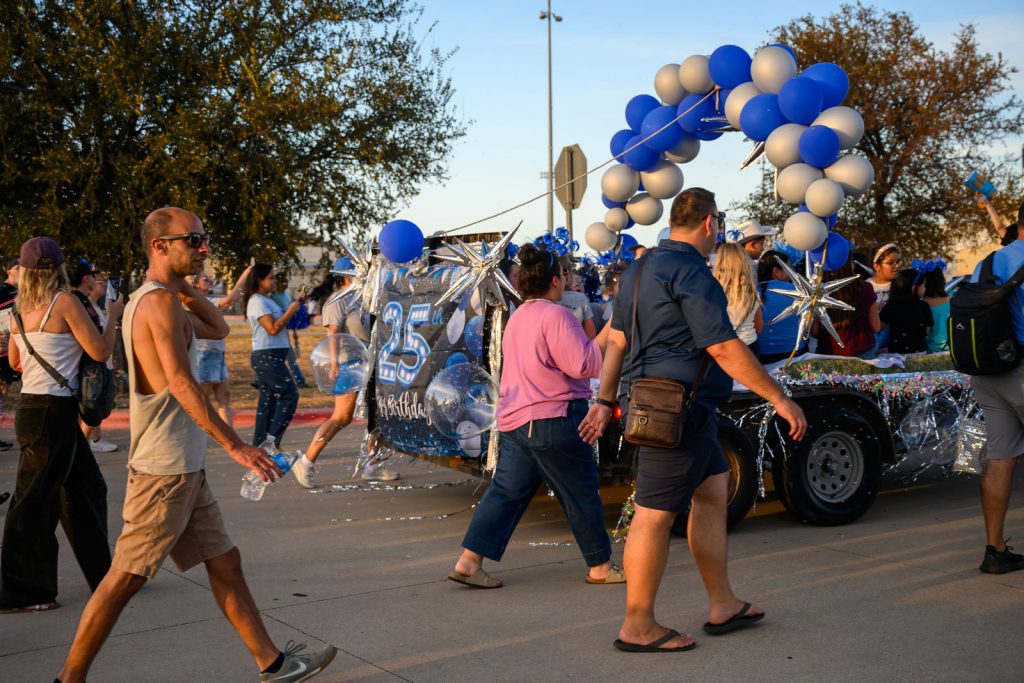 The Cox Elementary PTA float and Comet families in the Vista Ridge homecoming parade