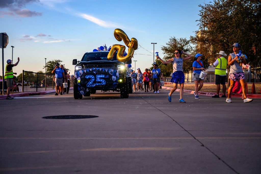 The Cox Elementary PTA float and Comet families in the Vista Ridge homecoming parade